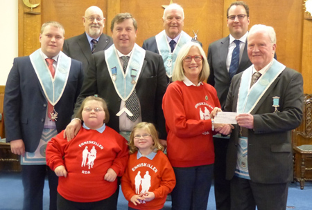 officers and brethren of 586 present cheque to the Riding for Disabled